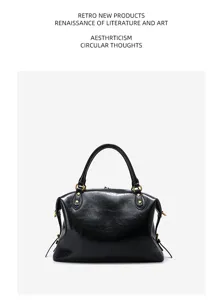 Detailed view of black genuine leather Boston handbag, classic motorcycle style daily bag.