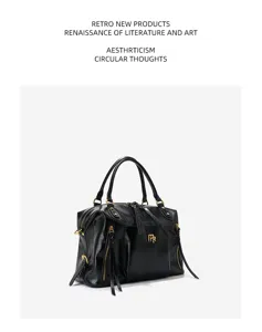 Genuine leather black Boston handbag for women, spacious commuter tote and stylish motorcycle bag.