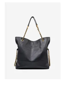 Black genuine leather tote bag with metal chain straps and chic geometric stitching design.