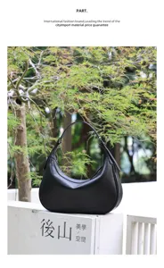 Black leather hobo shoulder bag for women, stylish crescent underarm commuter handbag.