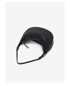 Detailed view of black crescent hobo shoulder bag, premium leather underarm daily commuting purse.