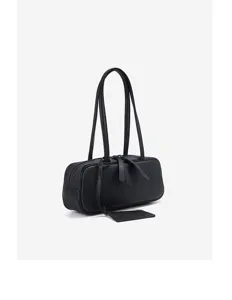 Close-up detail of black leather shoulder bag, stylish long bowling style with dual straps.