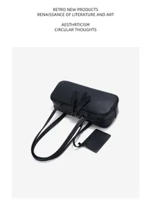 Detail view of the retro black leather boston shoulder bag, elegant and spacious design.