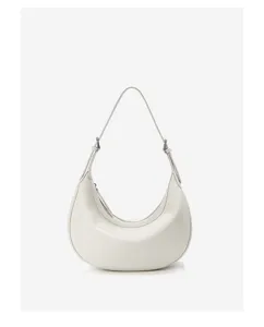 Detail view of a white minimalist hobo shoulder bag, featuring smooth leather texture and strap.