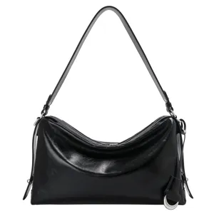 Black leather shoulder bag for women, stylish hobo baguette purse with zipper and elegant strap.