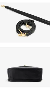 Black leather handbag strap and bottom profile detail, premium cowhide material with gold hardware.