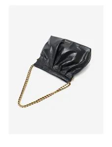 Close-up of black leather hobo bag showcasing soft folds and elegant gold chain shoulder strap.
