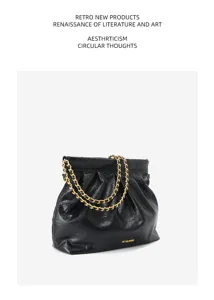 Black genuine leather slouchy tote bag detail, featuring soft pleated design and gold chain.