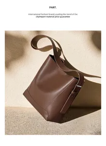 Elegant brown leather bucket bag for women, large capacity shoulder and crossbody tote design.