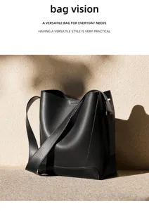 Detailed view of black leather bucket bag showcasing smooth texture and sleek craftsmanship.