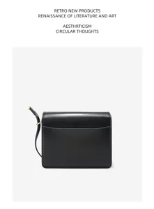 Black glossy leather minimalist cross-body square bag detail view, classic commute handbag.