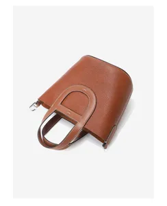 Premium Togo cowhide bucket bag for women, stylish brown leather shoulder handbag with top handle.