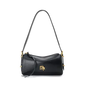 Black leather shoulder bag for women, stylish underarm baguette pillow bag with gold hardware.
