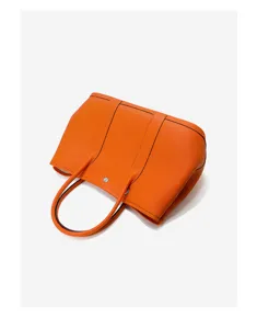 Orange leather tote bag for women, classic design shoulder handbag with top handles.