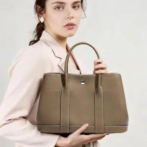 Elegant genuine leather tote bag for women, classic design shoulder bag for daily commute.