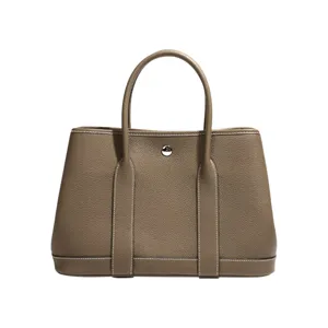 Elegant taupe leather tote bag for women classic daily commuter handbag with double handles.