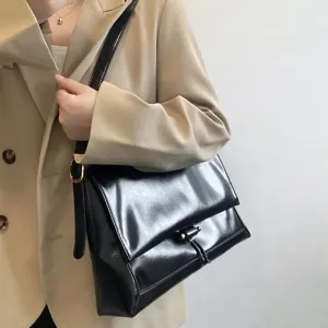 Black glossy leather shoulder bag for women, chic commuting messenger bag main view