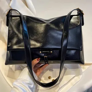 Black leather shoulder bag for women, large capacity underarm tote and messenger.
