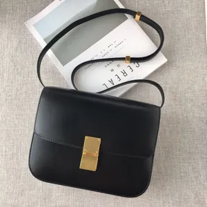 Classic black leather crossbody bag with elegant gold metal lock for women daily commute.