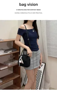 Black leather bowling handbag for women, versatile shell crossbody bag with stylish daily design.