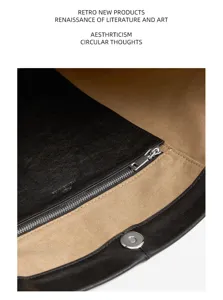 Vegetable tanned leather bucket bag interior detail showing zipper pocket and snap closure.