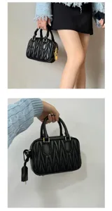 Black pleated mini bowling handbag, lambskin boston bag with gold hardware and top handles.