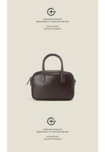 Retro genuine leather Boston handbag for women, classic bowling bag style for daily commute.