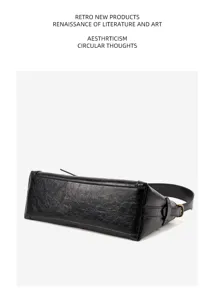 Detailed view of the black leather shoulder bag showcasing texture and sleek design.