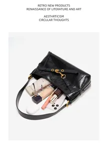Black leather shoulder bag with gold hardware, chic hobo bag for women daily commute.