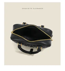 Black quilted leather mini bowling bag with gold hardware, elegant top handle boston handbag.