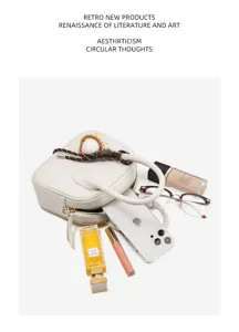 White leather bowling handbag for women, stylish niche design shell bag with top handle and zipper.