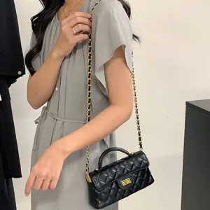 Classic black quilted chain shoulder bag for women, urban style elegant crossbody bag.