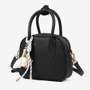 Women's black bowling bag shell crossbody handbag with cute baseball keychain charm stylish.