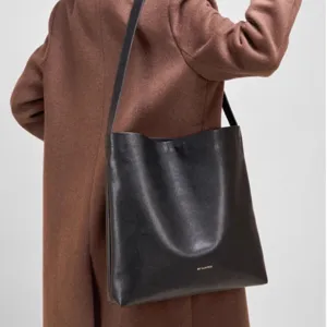 Minimalist black leather tote bag for women, large capacity shoulder bag for daily commute.