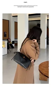 Black genuine leather shoulder bag for women, elegant commuter handbag with metal lock design.