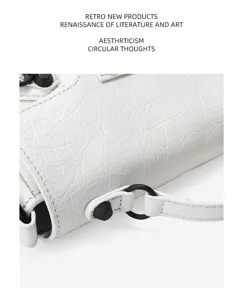 First layer cowhide NANO handbag retro motorcycle crossbody bag with unique white leather style.