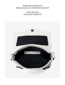 Top layer cowhide nano flap handbag detail, classic motorcycle shoulder bag with stylish buckle.
