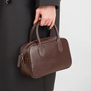 Genuine leather Boston bag for women, retro brown bowling handbag, stylish commuter shoulder bag.