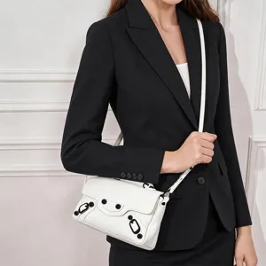 White leather motorcycle shoulder bag with classic metal studs and adjustable crossbody strap.