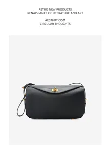 Black genuine leather detail showing exquisite metal turn-lock closure and smooth texture.