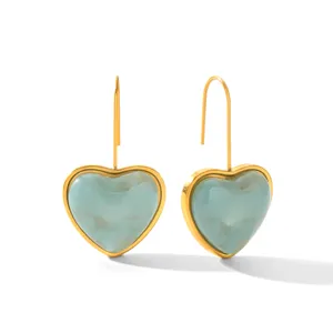 Chic heart-shaped dangling earrings with pastel blue resin and gold stainless steel hooks.