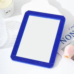 Blue rhinestone makeup mirror detail view, elegant desktop cosmetic mirror for daily vanity.