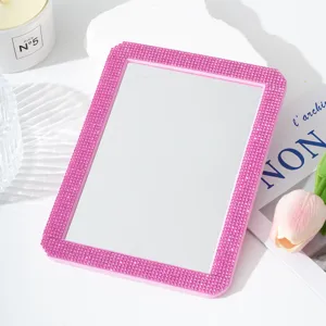 Detailed shot of a sparkling pink rhinestone makeup mirror, perfect for cute desktop decor and daily use.