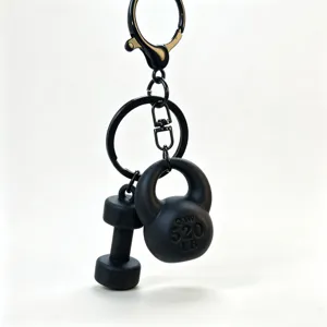 Mini fitness equipment keychain with dumbbell and kettlebell charms, stylish black metal finish.