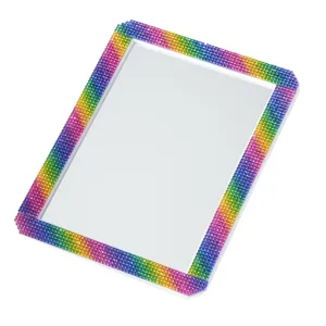 Detail view of portable rhinestone makeup mirror with rainbow crystal border for desktop vanity.