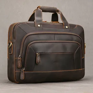 Valigetta vintage in pelle marrone con doppio manico, tracolla e diversi scomparti con zip