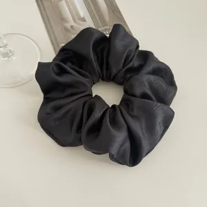 Elegant black satin hair scrunchie, large floral ponytail holder for women's daily styling.