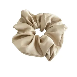 Elegant champagne satin hair scrunchie for women, large soft ponytail holder accessory.