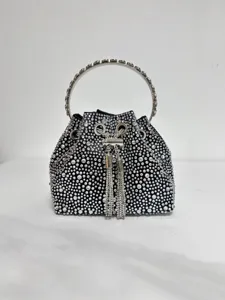 Stunning black rhinestone bucket bag evening handbag with metal handle and chic tassels.