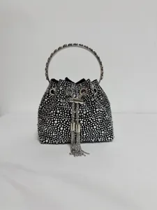 Black crystal evening bag with rhinestone tassel bucket design and metallic round handle
